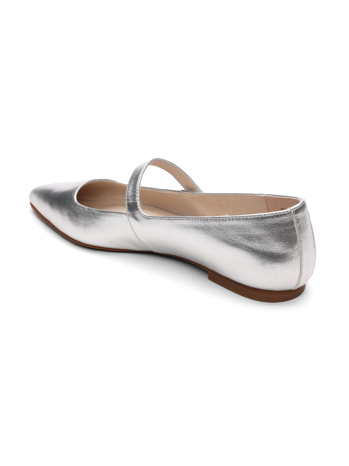 The Clamour Ballet Flat White Gold by Sanctuary Clothing is a sleek and modern shoe with a shiny silver exterior, featuring a pointed toe and a single strap crossing over the top. It has a low, flat heel, beige interior, and light tan sole, all set against a plain white background.