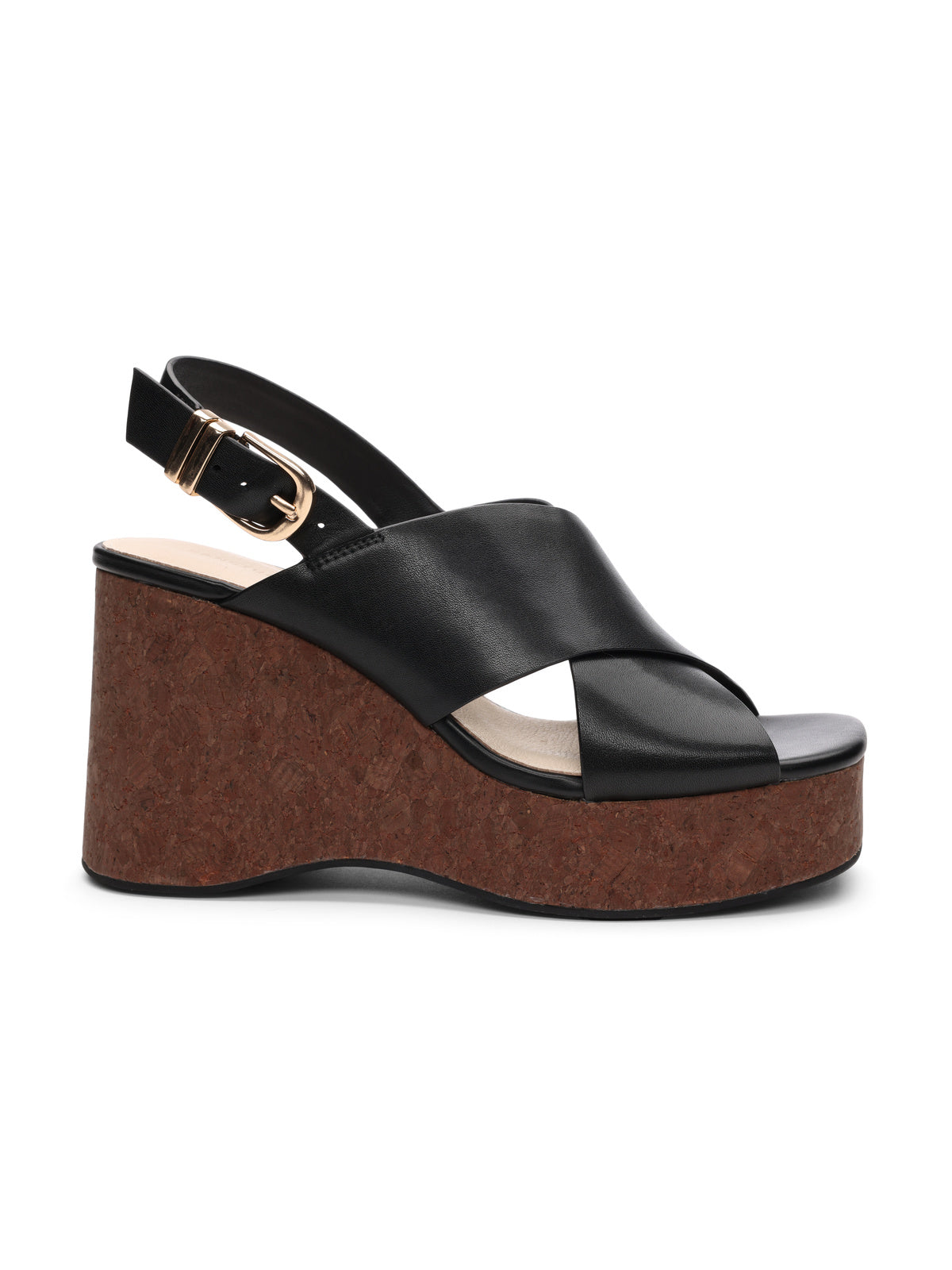 The "nouveau black" by Sanctuary Clothing features a side view of a black sandal with slingback straps, buckle, crisscross straps over the foot, and a brown cork wedge heel.