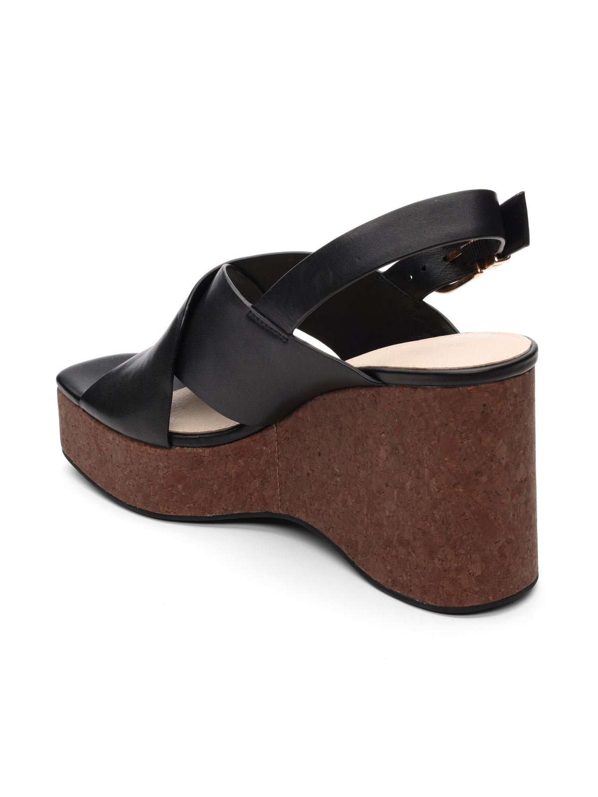 The "nouveau black" by Sanctuary Clothing is a black platform sandal with a cork wedge heel and crisscross leather straps. It features a smooth, curved heel design and an adjustable ankle strap with a buckle.