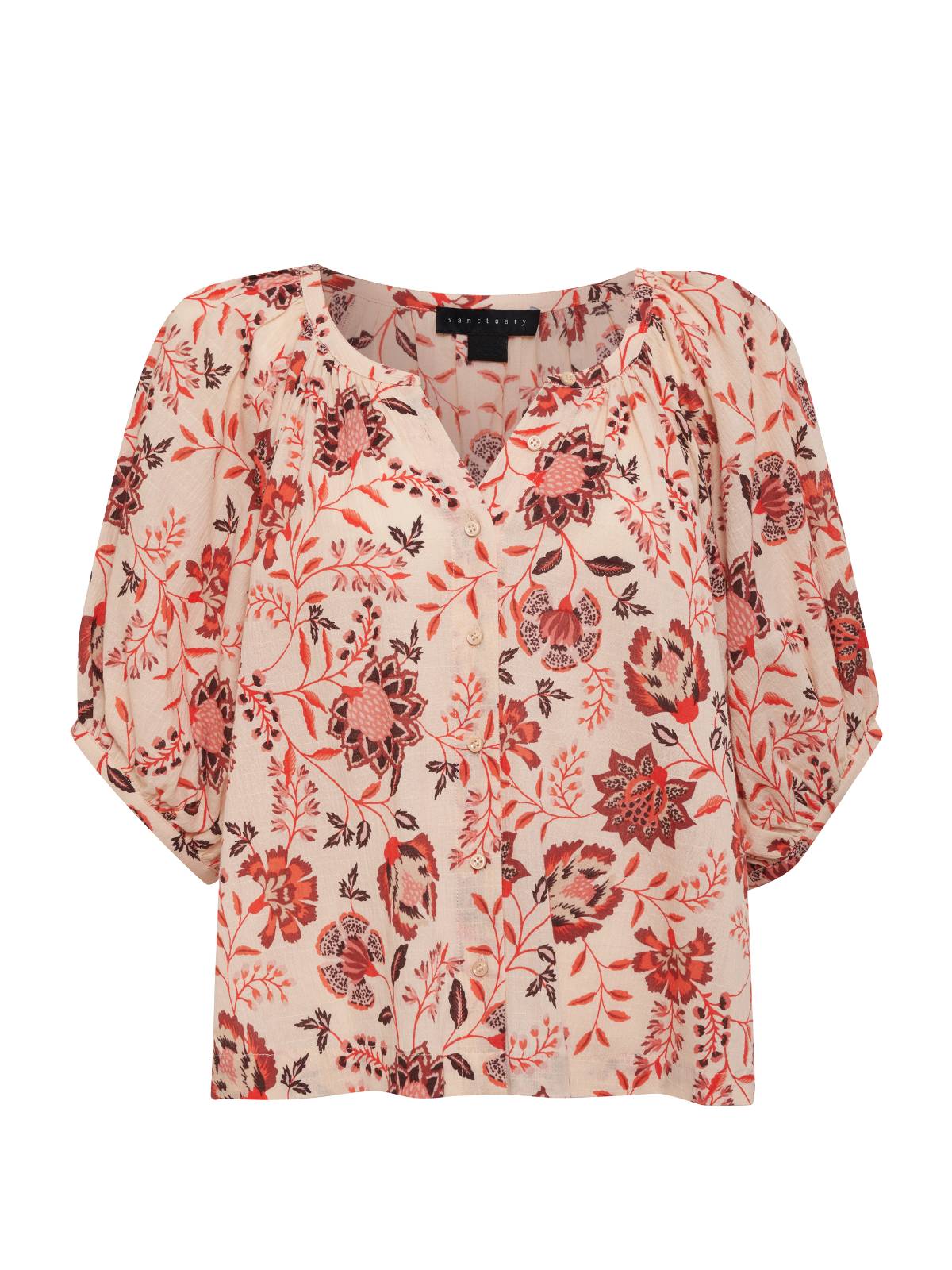 Experience the charm of the Bubble Sleeve Boho Blouse Pacific Light from Sanctuary Clothing. This white blouse is adorned with a vibrant floral print in shades of red, pink, and black. Its loose, flowing design features three-quarter bubble sleeves and a round neckline with a central slit. The lightweight fabric adds an airy touch to this stylish piece.