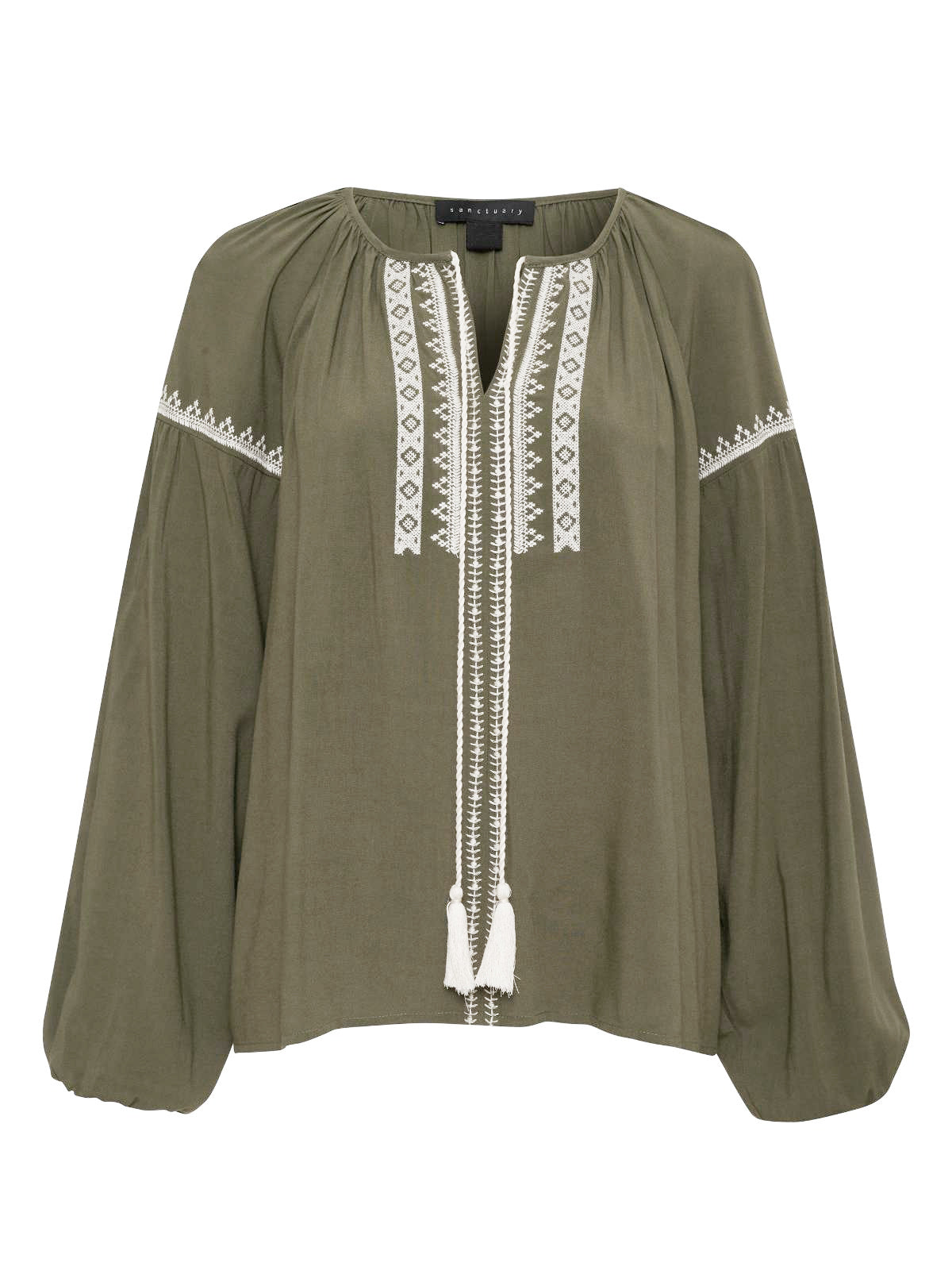 The Embroidered Blouse in Burnt Olive by Sanctuary Clothing showcases long, slightly puffed sleeves and intricate white embroidery along the neckline, center front, and sleeves. It features a V-neck with ties that dangle at the front, ending in white tassels.