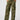 A person is wearing the Reissue Cargo Pant Renew Camo by Sanctuary Clothing with hands in the pockets. They are also wearing a beige sweater and black sandals with white soles. The background is plain white.