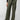 A person is wearing the "Satin Cargo Wide Leg Dark Olive" pants by Sanctuary Clothing, which feature multiple pockets and a drawstring waist. They have paired this outfit with black ballet flats and a black top. The background is plain and gray, and their left hand rests by their side.