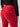 Revised Sentence: Rear view of a person wearing the Velveteen Hayden Bootcut Pant in Mars Red from Sanctuary Clothing, featuring flap back pockets. The person pairs it with a black long-sleeve top, and their left arm is slightly bent with the hand resting near the upper thigh. The Sanctuary Clothing brand label is visible on the upper right pocket flap.