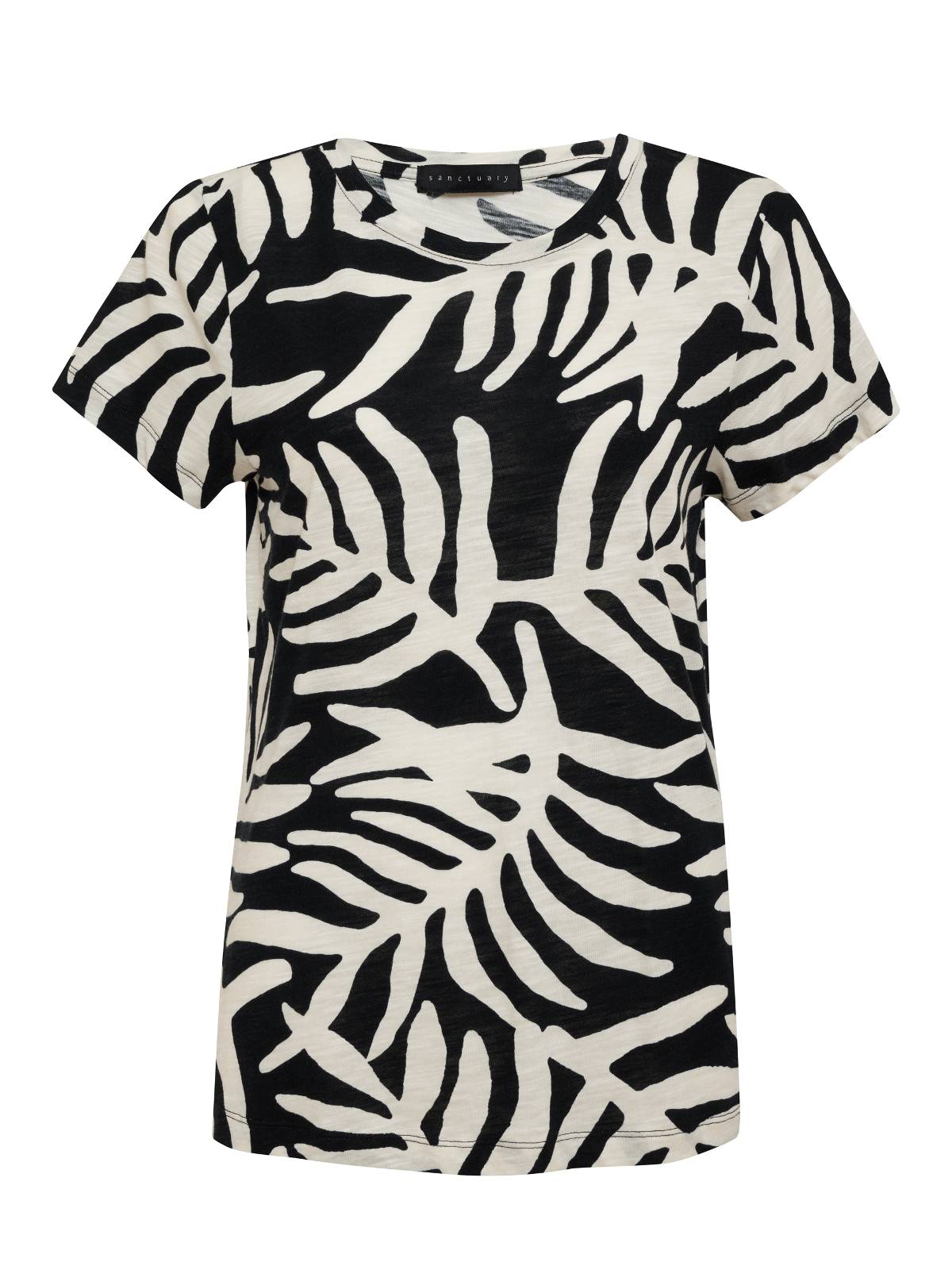 The Perfect Tee Night Palm by Sanctuary Clothing is a short-sleeved t-shirt showcasing a bold black and white foliage pattern with large, stylized leaf shapes spread across the entire shirt. The fabric has a slightly textured appearance, and it features a round neckline.