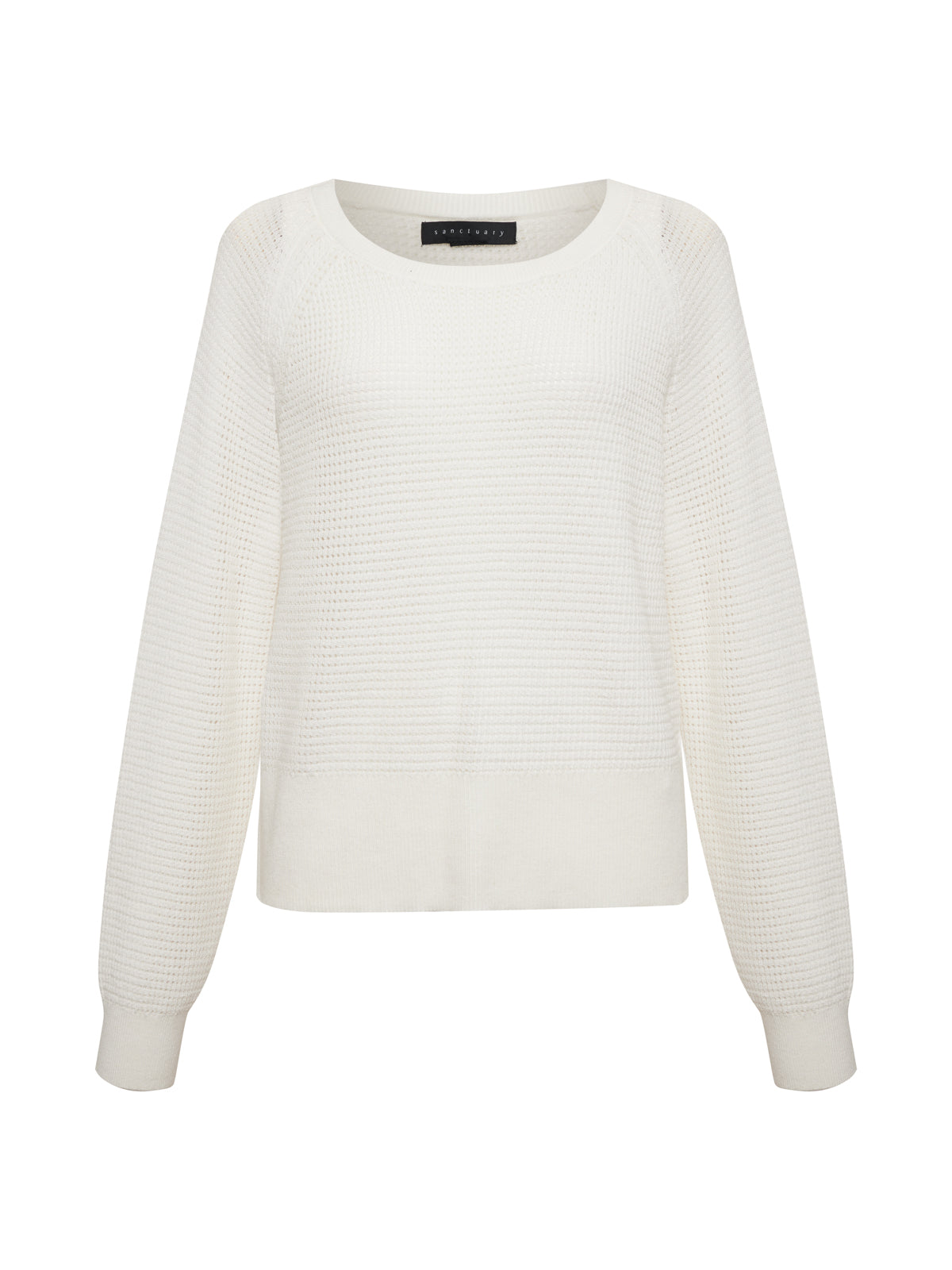 The Everyday Openwork Sweater Chalk from Sanctuary Clothing is a white, long-sleeve sweater featuring a textured knit pattern along with ribbed cuffs and hem. It has a wide, rounded neckline and the fabric looks cozy and soft.