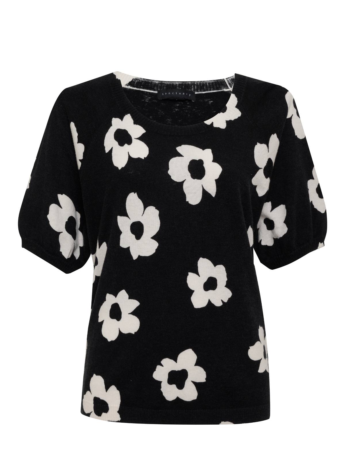 The Sunny Days Sweater Flower Pop by Sanctuary Clothing is a black short-sleeve sweater featuring a pattern of large white flowers. It boasts a rounded neckline and a relaxed fit, offering both casual and comfortable style.