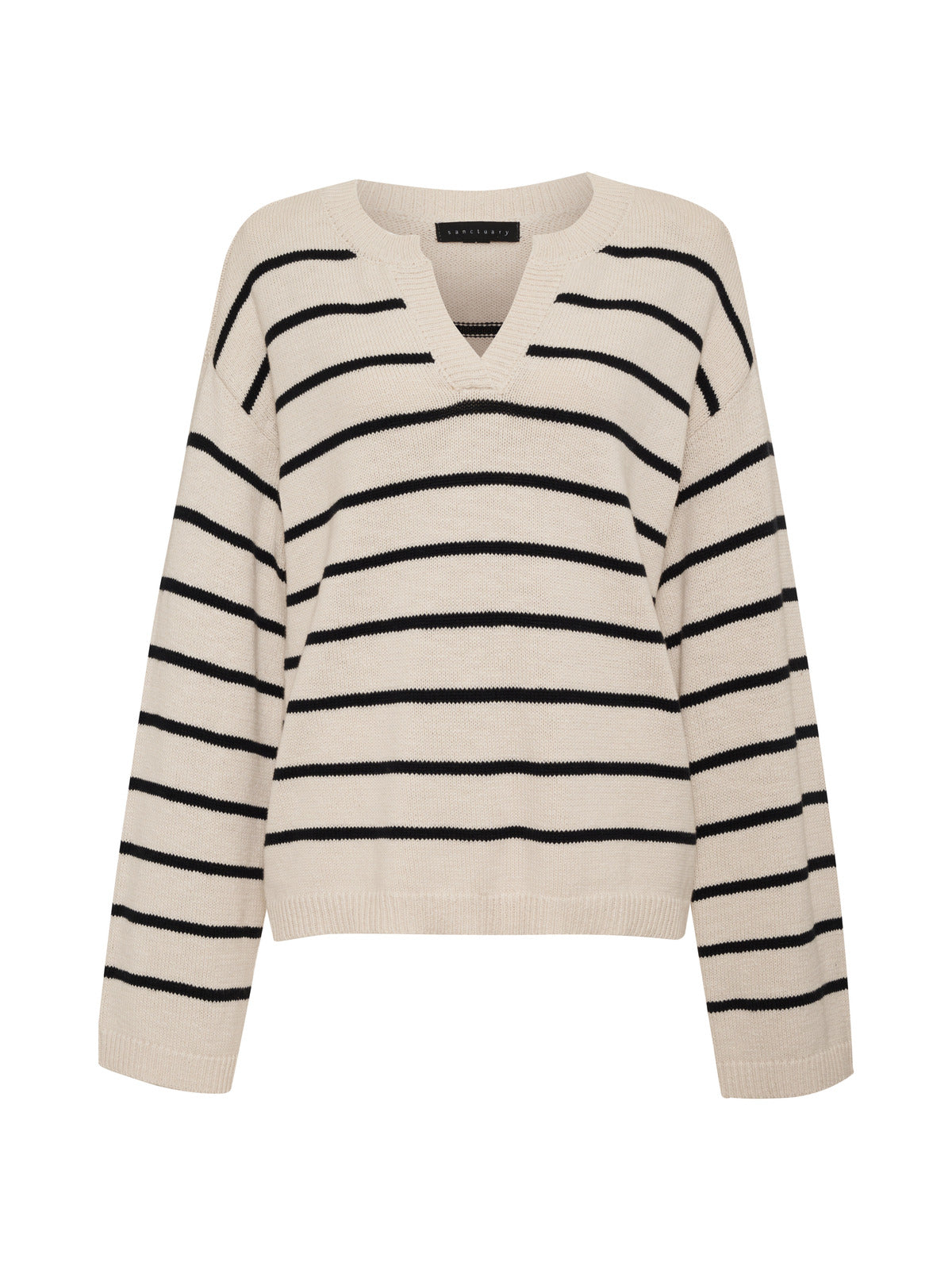 The Chill Vibes Sweater Chalk Black Stripe by Sanctuary Clothing is a relaxed-fit sweater with a beige base and black horizontal stripes. It features long sleeves, ribbed cuffs, and a hem.