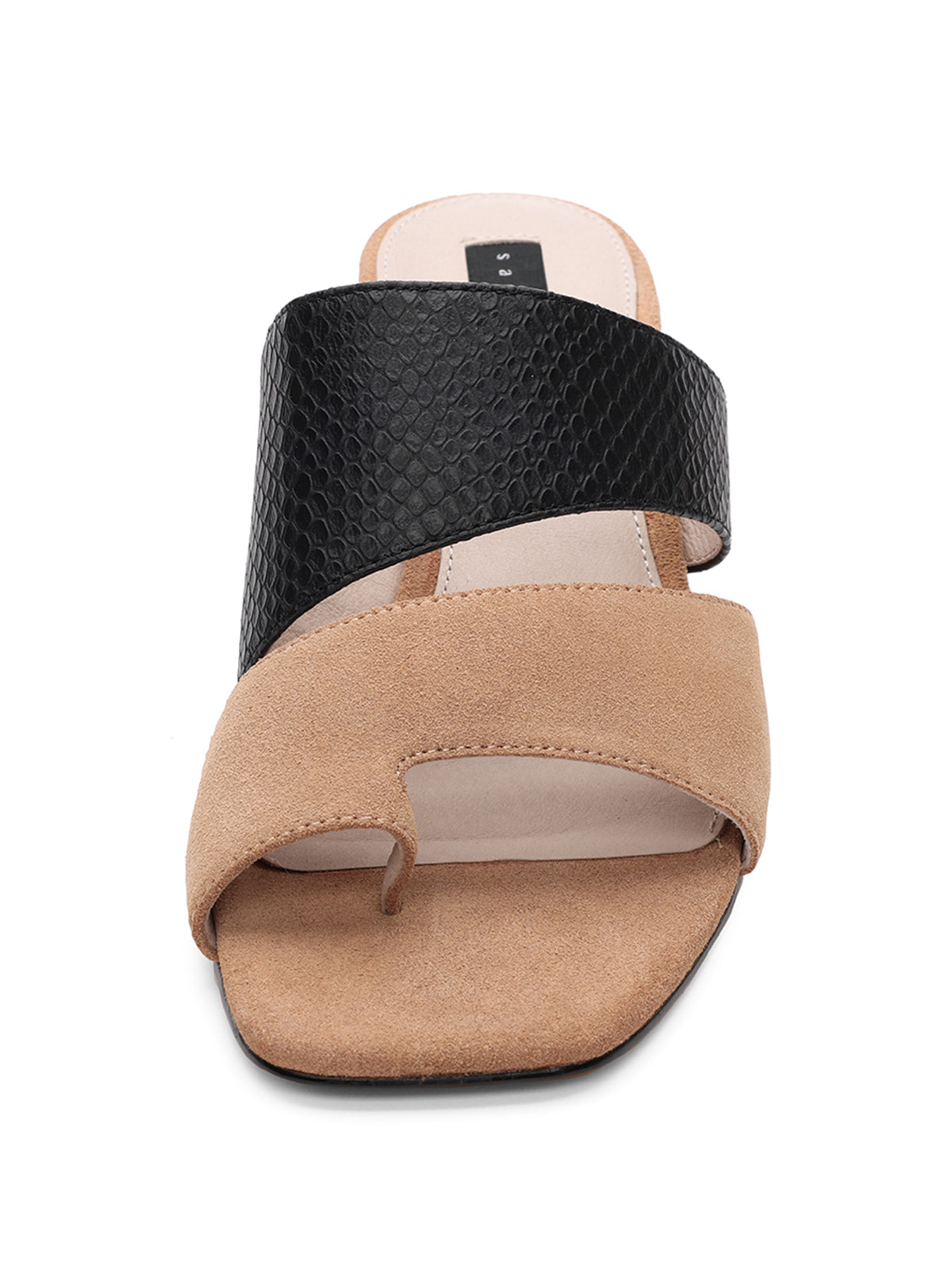 The Brisk Sandal Cafe Black by Sanctuary Clothing features a modern design for women. This sandal boasts a beige suede strap covering the toes with a cutout for the big toe, complemented by a black textured strap that crosses over the upper foot. The insole is light beige with minimal padding, and it has a flat sole.