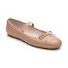 The "Facile Ballet Flat Nude" by Sanctuary Clothing is a single beige ballet flat shoe with a round toe, featuring a small bow on the front and an elastic strap across the instep. The shoe also boasts a low heel and a smooth, glossy finish.