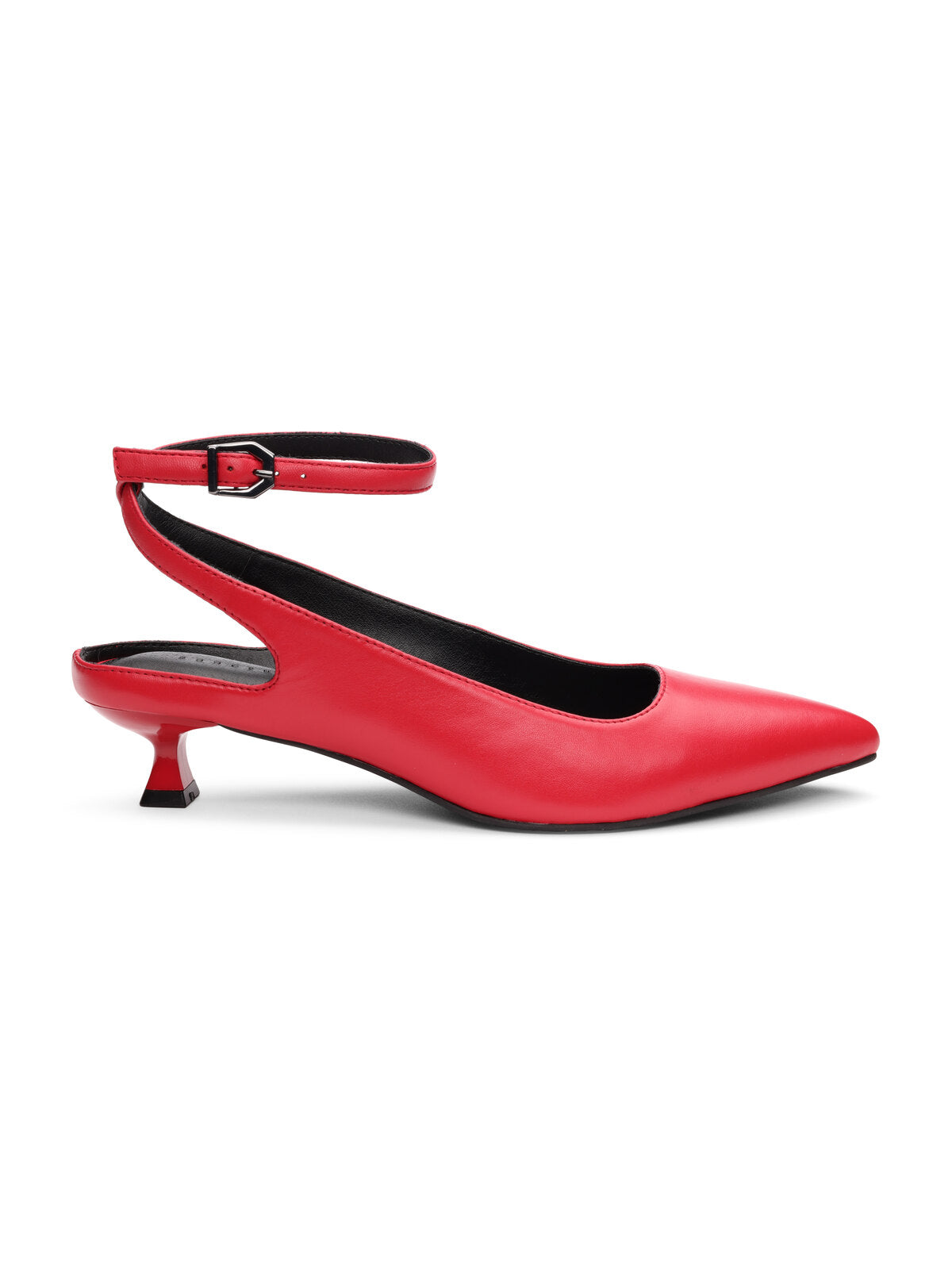 The Magic Pump Red by Sanctuary Clothing is a sleek and elegant women's shoe featuring a sharp pointed toe, a thin adjustable ankle strap with a buckle, and a small, short, angled heel. The interior lining and sole are black.