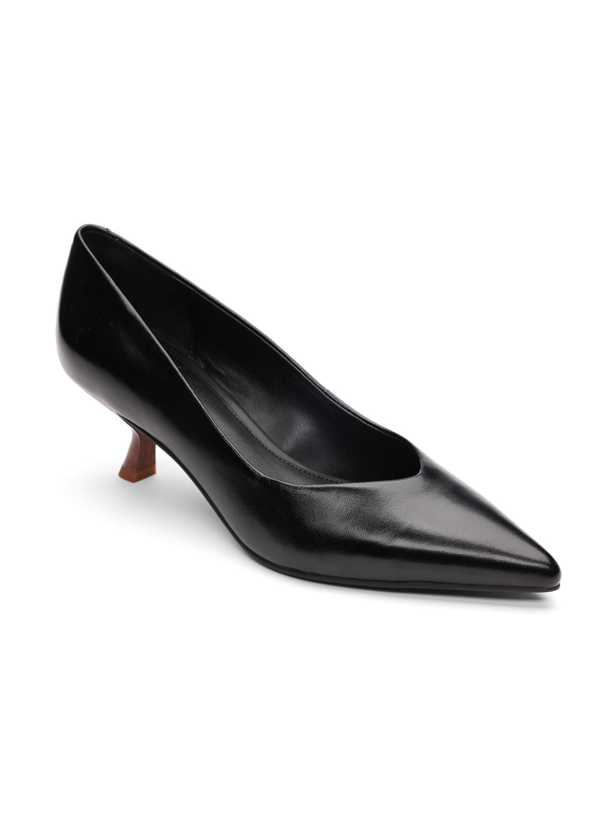 The Padma Pump Black by Sanctuary Clothing is showcased against a plain white backdrop. This black leather pump features a pointed toe and a low, brown kitten heel, boasting a sleek, shiny finish and a simple, elegant design.