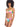 A woman with curly hair is wearing the Daytripper Bandeau Bikini Top Multi from Sanctuary Clothing, featuring a colorful, abstract pattern. She pairs it with matching bikini bottoms and stands while looking slightly off to the side, maintaining a neutral expression against a plain white background.