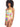 A woman with curly hair wears the Sanctuary Clothing Daytripper One Shoulder Bikini Top Multi, which features cutout details and a high-waisted bottom. The swimsuit boasts a vibrant, abstract pattern in shades of green, yellow, purple, and pink. She stands against a plain white background.