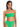 A woman is wearing the Refresh Rib Bandeau Bikini Top in Green Flare by Sanctuary Clothing, paired with high-waisted bikini bottoms. The bikini features a textured, ribbed design. She has long, dark hair that is slicked back and is standing against a plain white background, looking into the camera.