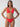 A person with long hair is wearing the Refresh Rib Double Layer Underwire Bikini Top in Mars Red from Sanctuary Clothing, standing against a plain, light-colored background. They carry a confident expression with their hands on their hips.