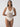 A person poses in the Sea Crochet High Leg Scoop Neck One Piece White Sand swimsuit by Sanctuary Clothing, set against a plain background. They have long hair and are looking directly at the camera with a neutral expression.