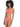 A woman with curly hair is wearing a watermelon sugar bikini from Sanctuary Clothing's Sandbar Solids collection. She is standing and posing with one hand resting by her side. The bikini includes a top with a knotted center and simple bottoms. The background is white.